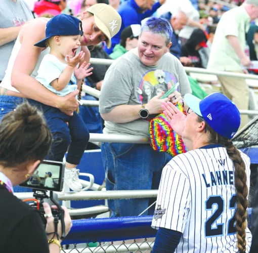 Women’s baseball openers draw frenzied crowds